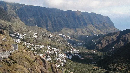 Panoramic view of Hermigua with white houses and mountains in La Gomera.