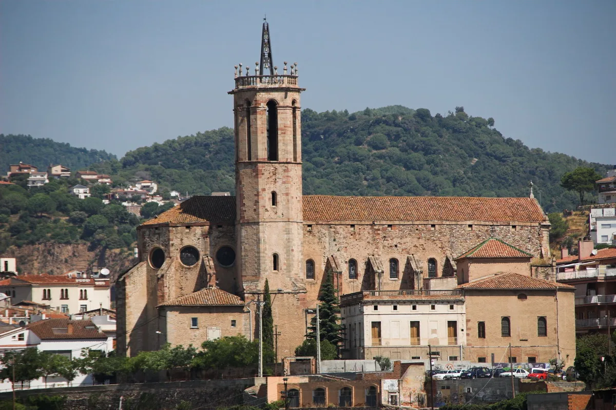 Santa Maria parish church in Caldes de Montbui with baroque architecture and tower.