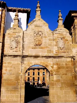 Stone gate with shields and architectural details in Los Arcos, Navarra.