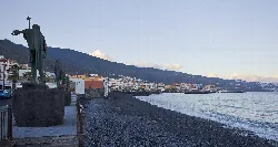 Beneharo statue in Candelaria next to the sea and coast.