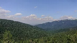 Green mountains and sky with clouds in Valsaín, Segovia