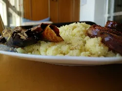 Migas de Almería with eggplants and chorizo on a plate.