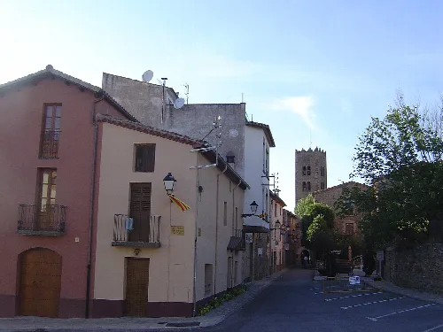 Image of the entry on the ancient nucleus of Seva, in the background the church of Santa Maria of Seva.