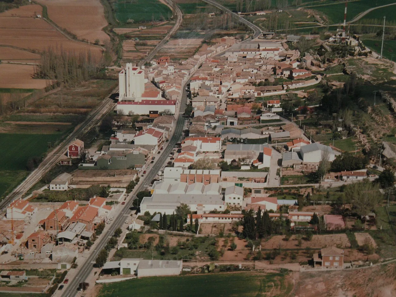 Aerial view of Chillarón de Cuenca with streets and buildings in the center.