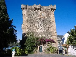 Stone Andrade Tower with coat of arms in Pontedeume.
