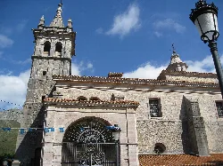 Stone church with tower and bell tower in Alles, Asturias.