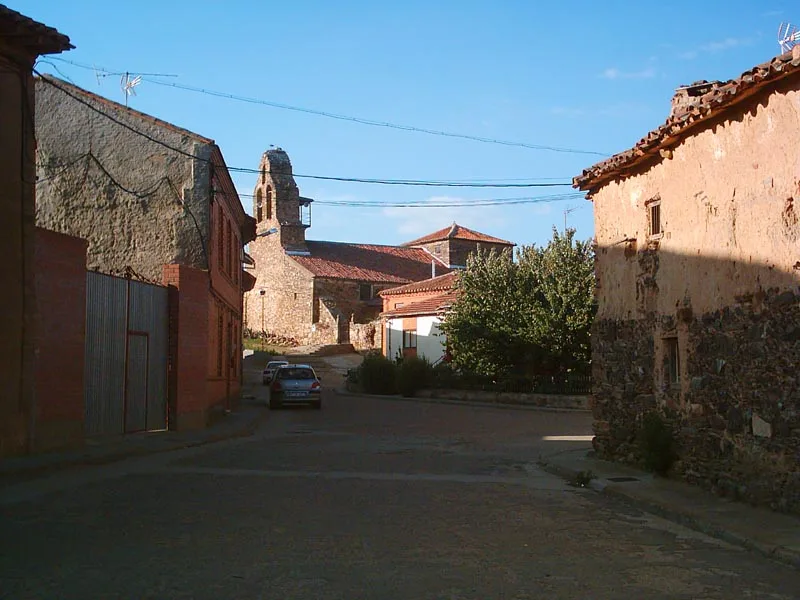View of the street with the church in the background in Coomonte.