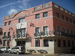 Town hall building with pink facade and balconies in Rafelbuñol.