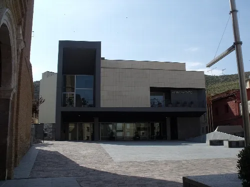 Cadrete town hall building with modern facade and large windows.