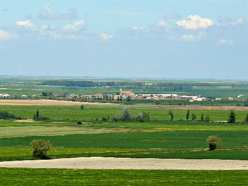 Rural landscape with fields and cloudy sky seen from Montealegre in Meneses de Campos.