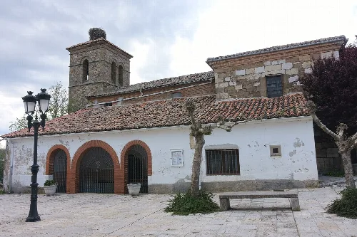 San Juan Bautista church with tower and white facade in Fresno del Río.