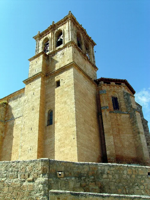 Church tower seen from below, with bells and windows.