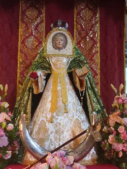 Statue of the Virgin of the Incarnation with dress and flowers in Adeje.