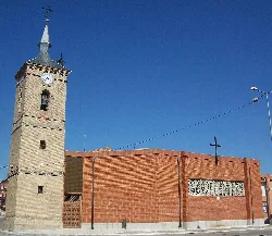 Church of John the Baptist with tower and clock in Cobeja.