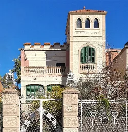 Villa Esperança with tower and classic facade in Santa Coloma de Gramenet.