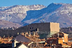 Pablo Neruda Theater with snowy mountains in the background.