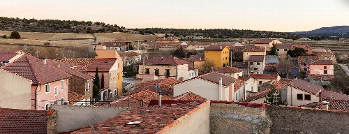 View of houses with red roofs and streets in Establés, Guadalajara.