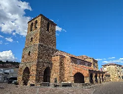 Santa María Church with stone tower in Castrillo de la Valduerna.