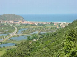 Marshlands, beach, and green hills in Santoña, Cantabria.