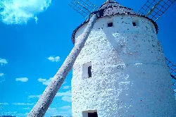 Ojos Negros windmill with blades and white structure.