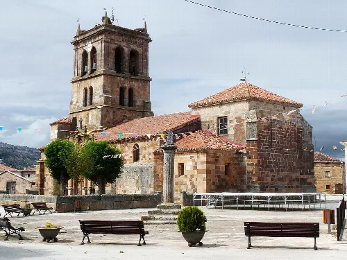 San Pedro Church with tower and stone facade in Barbadillo del Mercado.