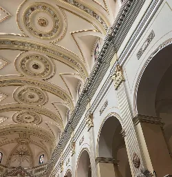 Decorated ceilings and columns in the central nave of a church in Carlet.