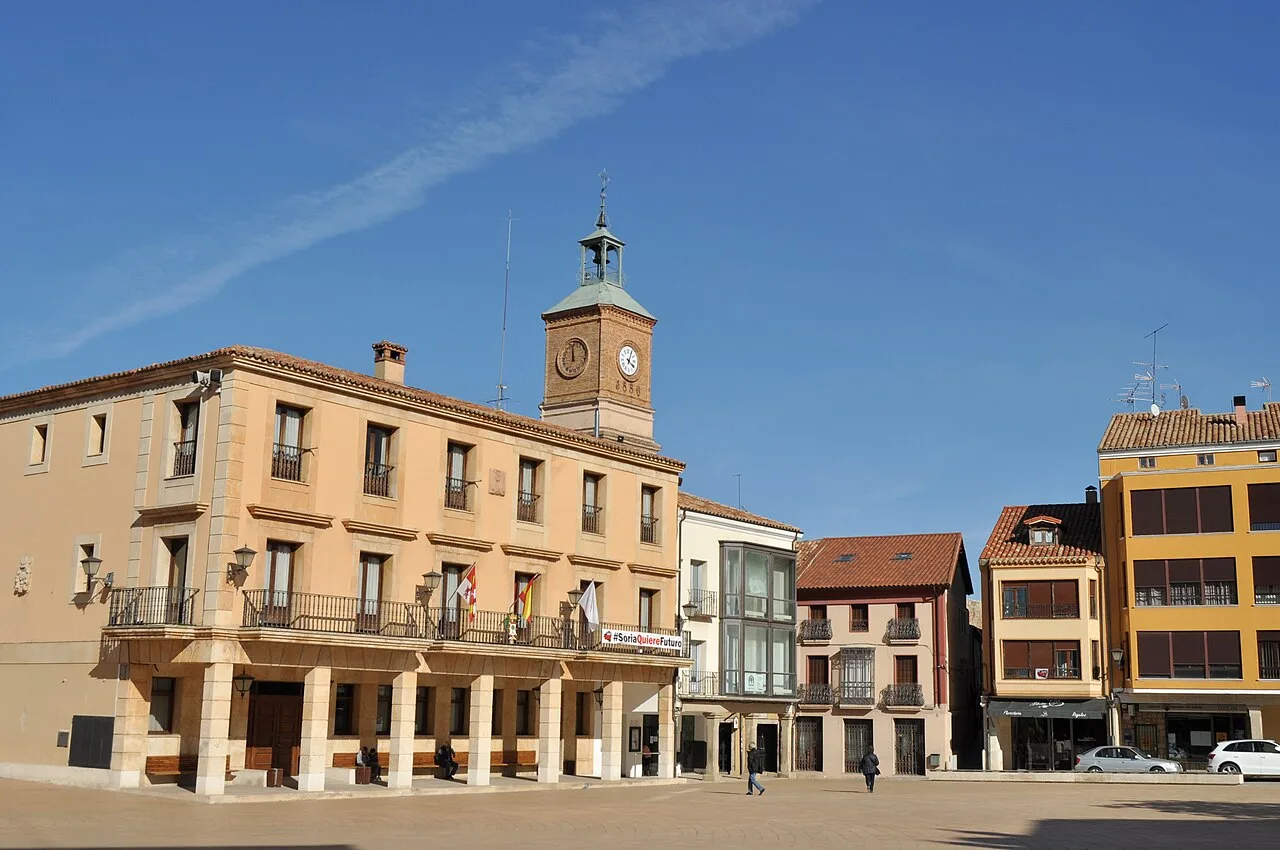 Building with clock and square in Almazán, Soria.