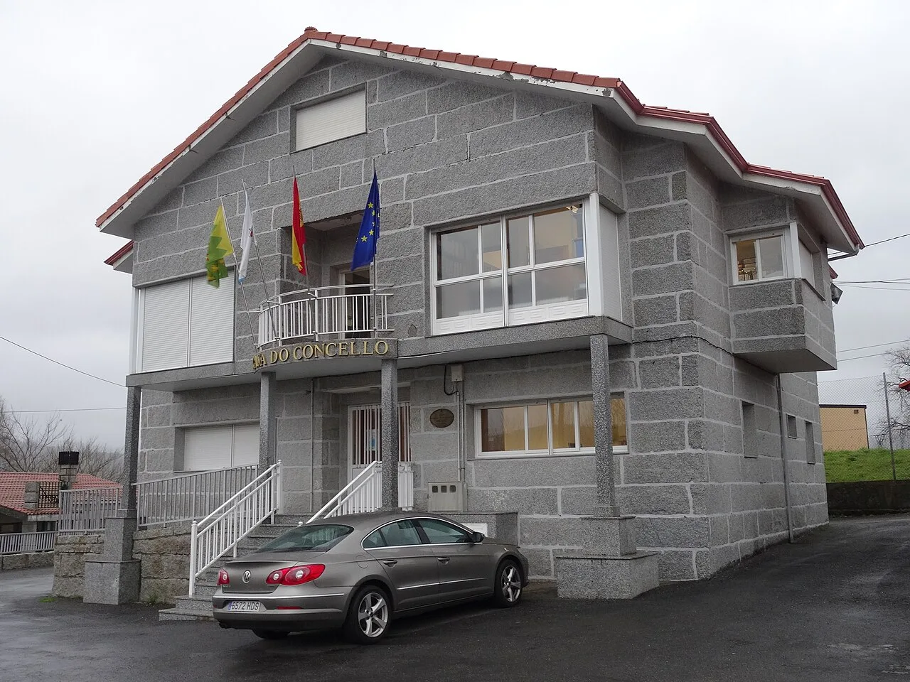 Town hall with flags on the facade.