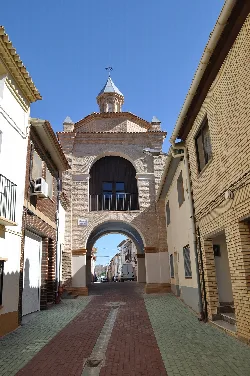 San Roque Portal with arch and tower in Quinto.