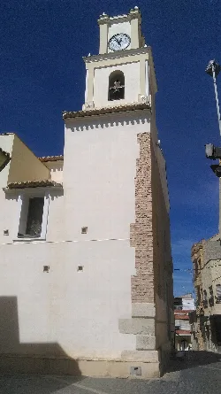 Church tower with clock and bell tower in Alcantarilla.