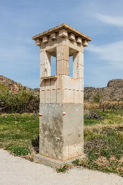 San Antón's wayside shrine, stone structure with white and red details in Morata de Jalón.