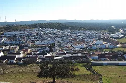 Panoramic view of El Real de la Jara from the Castle with houses and rural landscape.