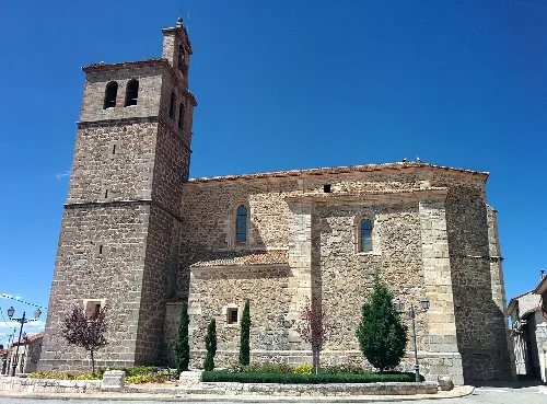 Stone church with tower and facade in Otero de Herreros.