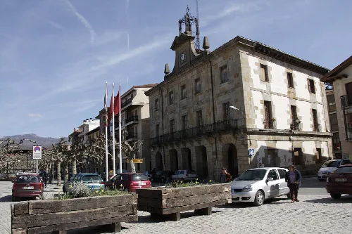 Classic-style building with flags in the main square of Etxarri-Aranatz, Navarre.