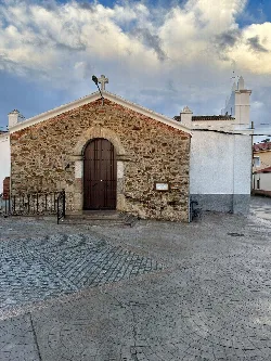 Main door of Santa Catalina Church with cloudy sky.