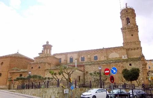 Church of Our Lady of the Angels in Mallén, Zaragoza, with tower and brick walls.