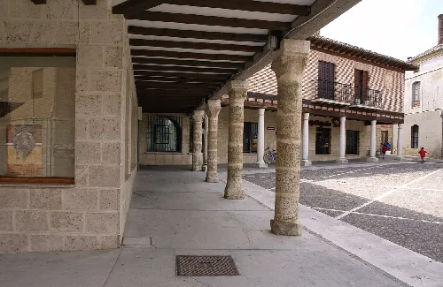 Stone columns and buildings in Astudillo's square.