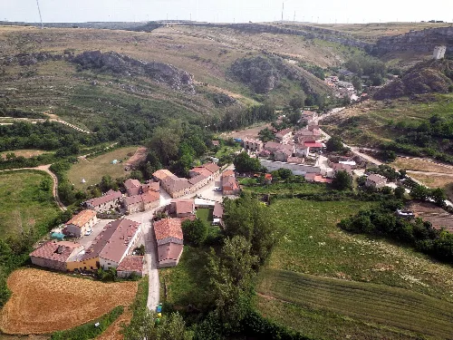 Aerial view of houses and fields in Úrbel del Castillo, Burgos.