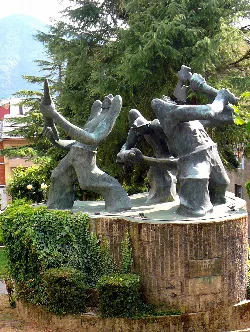 Miner sculptures with tools in a monument in Villablino.
