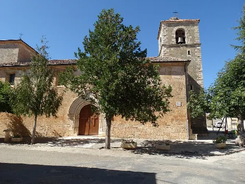 Santiago Apostle Church with tower and stone facade in Navares de Enmedio.