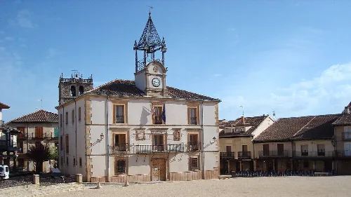 Building with clock and bell tower in Riaza's main square.