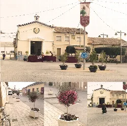 Pequeña iglesia con decoraciones y personas en la plaza de Catral.