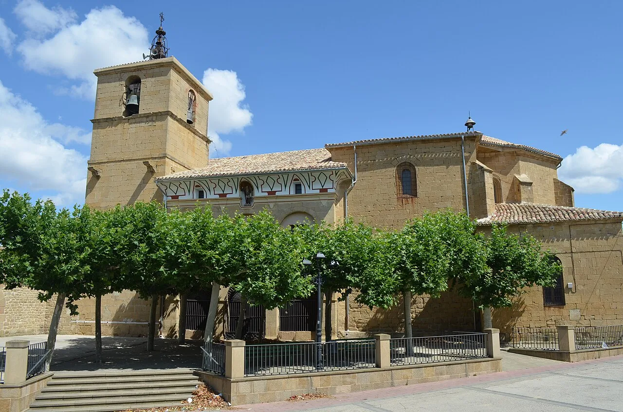 Church of San Miguel with trees in the town hall square.