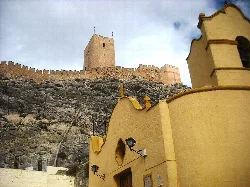 San Blas Hermitage and castle in Sax, Alicante, on a rocky hill.