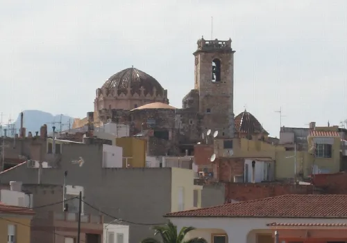 View of the church with dome and bell tower in Canet lo Roig.