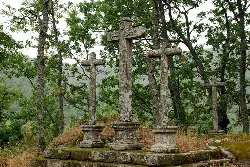 Stone crosses in a wooded setting in Las Casas del Conde.