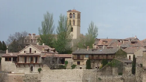 View of houses and a tower in Pedraza, Segovia, Spain