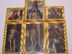 Six religious paintings framed in Higuera la Real church.