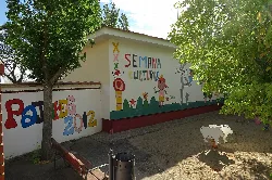 Colorful mural with children and animals in Pajares de la Lampreana