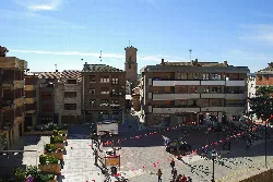 Plaza de España in Marcilla, Navarra, with buildings and pedestrian zone.